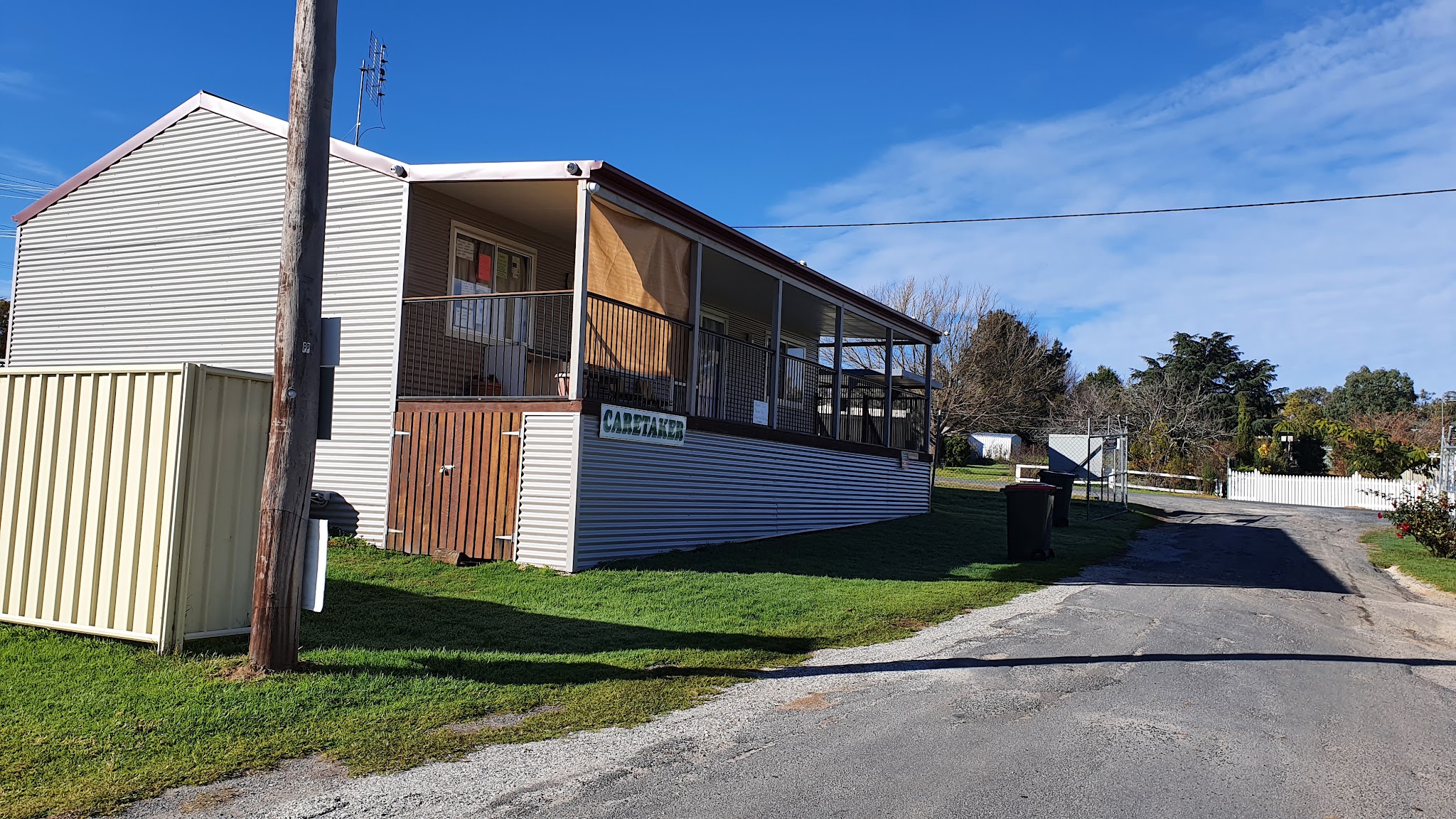 The caretaker's cottage at Tenterfield Showground with the Caretaker sign on the porch
